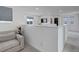 Bright loft space with neutral tones, a comfy armchair, and views from its many windows at 10906 Touchstone Loop, Parker, CO 80134