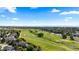 Stunning aerial view of the community golf course, showcasing the meticulously maintained green spaces at 9491 Southern Hills Cir, Lone Tree, CO 80124