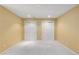 A bedroom featuring yellow walls, white doors, neutral carpet and base trim at 9491 Southern Hills Cir, Lone Tree, CO 80124