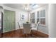 Eat-in kitchen featuring modern lighting, glass table, and seating for four at 9491 Southern Hills Cir, Lone Tree, CO 80124