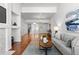 Bright living room featuring hardwood floors, neutral walls, and recessed lighting at 9491 Southern Hills Cir, Lone Tree, CO 80124