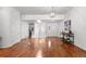 Open-concept room with hardwood floors, lots of natural light and modern light fixtures at 9491 Southern Hills Cir, Lone Tree, CO 80124