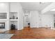 Living room featuring hardwood floors, fireplace, and access to other rooms at 9491 Southern Hills Cir, Lone Tree, CO 80124