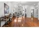 Open-concept living area featuring hardwood floors, high ceilings, and lots of natural light at 9491 Southern Hills Cir, Lone Tree, CO 80124