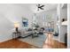 Bright living room boasts a fireplace, hardwood floors, and lots of natural light at 9491 Southern Hills Cir, Lone Tree, CO 80124