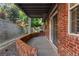 Covered patio with brick details, offering a great space for outdoor enjoyment and relaxation at 9491 Southern Hills Cir, Lone Tree, CO 80124