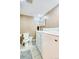 Functional laundry room featuring tile floors, washer, dryer, and a toilet at 1510 S Knox Ct, Denver, CO 80219