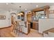 An entertainment area features a bar with seating and plentiful cabinetry at 6330 Old Orchard Ln, Sedalia, CO 80135