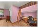 Bedroom with a unique loft bed and desk area, offering a creative and functional space at 6330 Old Orchard Ln, Sedalia, CO 80135
