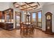 Bright dining area with backyard views and modern chandelier at 6330 Old Orchard Ln, Sedalia, CO 80135