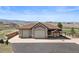 Ranch style home, with a three-car garage and mountain views at 6330 Old Orchard Ln, Sedalia, CO 80135