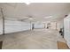 Oversized three-car garage with ample space for parking and storage at 6330 Old Orchard Ln, Sedalia, CO 80135