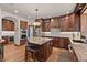 Gourmet kitchen with custom cabinets, stainless appliances, and granite countertops at 6330 Old Orchard Ln, Sedalia, CO 80135