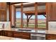 Open kitchen features mountain views and granite counters at 6330 Old Orchard Ln, Sedalia, CO 80135