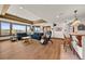 A comfy living room features large windows with gorgeous yard views at 6330 Old Orchard Ln, Sedalia, CO 80135