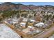 Wide aerial view of a charming neighborhood surrounded by picturesque mountain scenery at 16 Prairie St, Palmer Lake, CO 80133