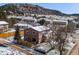 Aerial view of a home with mountain views in a neighborhood at 16 Prairie St, Palmer Lake, CO 80133