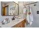 Bathroom vanity with a sink, a large mirror, and decorative touches for a cozy feel at 16 Prairie St, Palmer Lake, CO 80133