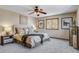 Inviting bedroom with decorative pillows, a ceiling fan, and stylish furnishings at 16 Prairie St, Palmer Lake, CO 80133
