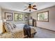 Comfortable bedroom featuring a ceiling fan, dresser, and plenty of natural light at 16 Prairie St, Palmer Lake, CO 80133