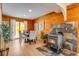 Dining room with wood walls, fireplace, and views at 16 Prairie St, Palmer Lake, CO 80133