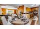Cozy dining area with a round table, wood accents, and an open view to the living room, creating a warm and inviting space at 16 Prairie St, Palmer Lake, CO 80133