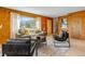 Comfortable living room featuring wood walls, stylish furniture, and mountain views at 16 Prairie St, Palmer Lake, CO 80133