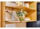 Wooden shelves displaying decorative items, adding charm and personality to the space at 16 Prairie St, Palmer Lake, CO 80133