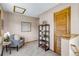 Cozy sitting area featuring a comfortable chair, stylish shelving, and charming decor at 16 Prairie St, Palmer Lake, CO 80133