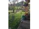 Green yard with flowering plants and mountain view at 16 Prairie St, Palmer Lake, CO 80133