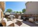 Backyard deck area with patio furniture and grill, perfect for outdoor entertaining at 21111 E 43Rd Ave, Denver, CO 80249