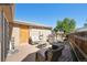Backyard featuring a wooden deck, patio furniture, and a grill for outdoor cooking and relaxation at 21111 E 43Rd Ave, Denver, CO 80249