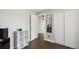 Bedroom view with a mirrored closet and dark laminate flooring at 21111 E 43Rd Ave, Denver, CO 80249