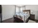 Bedroom features a queen-size bed with a blue and pink comforter and a modern design at 21111 E 43Rd Ave, Denver, CO 80249