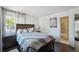 Cozy bedroom featuring a comfortable bed, side table, and a modern window at 21111 E 43Rd Ave, Denver, CO 80249