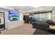 Cozy bedroom featuring a TV, sleek furniture, and a tranquil city view from the window, perfect for relaxation at 21111 E 43Rd Ave, Denver, CO 80249