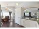 Kitchen-adjacent living room with bar counter and additional seating areas, ideal for hosting and entertaining at 21111 E 43Rd Ave, Denver, CO 80249