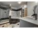 Elegant bathroom featuring a glass enclosed shower, soaking tub, and marble countertops at 97 Soda Creek Rd, Evergreen, CO 80439