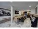 Spacious dining area with modern decor, featuring marble flooring and ample seating for entertaining at 97 Soda Creek Rd, Evergreen, CO 80439