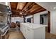 Stylish kitchen with exposed beams, large island, and modern appliances that blend rustic with modern at 97 Soda Creek Rd, Evergreen, CO 80439