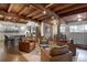 Cozy living room with exposed wooden beams and a seamless transition to the well-equipped kitchen at 97 Soda Creek Rd, Evergreen, CO 80439