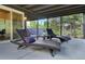Inviting outdoor patio with comfortable lounge chairs overlooking the serene greenery at 97 Soda Creek Rd, Evergreen, CO 80439