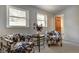 Cozy sitting area with black and white cow print chairs and plenty of natural light at 97 Soda Creek Rd, Evergreen, CO 80439