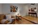 Charming sitting area with hardwood floors, a cozy chair, and unique decor, perfect for reading or relaxing at 97 Soda Creek Rd, Evergreen, CO 80439