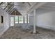 Bright sunroom with ample natural light, white walls, and a view of the outdoors at 97 Soda Creek Rd, Evergreen, CO 80439