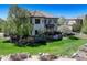 Lush backyard with a well-maintained lawn and mature trees at 12825 W 81St Ave, Arvada, CO 80005