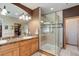 Elegant bathroom featuring a walk-in shower and dual sinks with granite countertops at 12825 W 81St Ave, Arvada, CO 80005