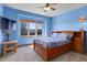 Inviting blue bedroom offering great natural light and a full wooden bedroom set at 12825 W 81St Ave, Arvada, CO 80005