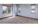 Spacious bedroom with carpeted floors, three windows and natural-wood trim at 12825 W 81St Ave, Arvada, CO 80005