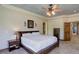 Main bedroom featuring a trey ceiling, carpeting, and furniture at 12825 W 81St Ave, Arvada, CO 80005